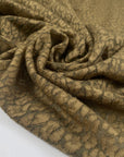 Green spotted wool jersey warm soft and slightly stretchy ideal for cozy tops dresses and light outerwear. High-quality deadstock collected in Stock from a Maison de Couture in Italy.