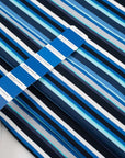 Cotton jersey with blue and white stripes blue background, soft and stretchy. Deadstock fabric picked up from a Maison de Couture in Italy.