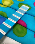Soft and lightweight pure viscose with a turquoise base and large multicolor polka dots. Flowy and not transparent, ideal for dresses, skirts, trousers, and blouses.High-quality deadstock collected in Stock from a Maison de Couture in Italy.