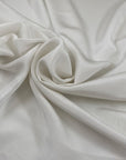 Pure heavy silk, crepe de chine in white. Very soft and light, a little transparent. High-quality deadstock fabric by the meter collected in Stock from a Maison de Couture in Italy.