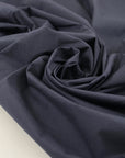 Stretch cotton linen in dark blue, very soft, light, slightly crunchy, and not transparent. Ideal for trousers, jackets, skirts, and dresses. High-quality deadstock collected in Stock from a Maison de Couture in Italy.