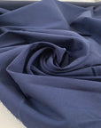 Pure cotton fabric in blue, very thick and stiff with a dry handfeel, ideal for structured garments, jackets, and utility pieces. High-quality deadstock collected in Stock from a Maison de Couture in Italy.