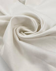 Heavy white cotton with slight stretch, very soft and warm to the touch, ideal for hoodies, jackets, trousers, and structured garments. High-quality deadstock collected in Stock from a Maison de Couture in Italy.