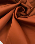Double-face waterproof fabric in wool, polyamide, silk and elastane. In cinnamon stick on one side and sand on the reverse. Ideal for outerwear. High-quality deadstock collected in Stock from a Maison de Couture in Italy.