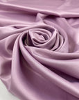 Lilac matte polyester satin with a soft hand and elegant drape, perfect for dresses, linings, and fluid pieces. High-quality deadstock collected in Stock from a Maison de Couture in Italy.