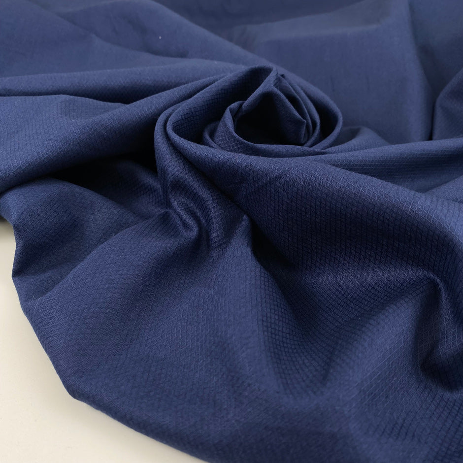 Cottone popeline with texture in medium blue very soft and light. High-quality deadstock fabric by the meter collected in Stock from a Maison de Couture in Italy.