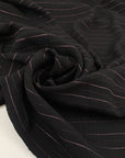 Pure viscose crepe in black with stripe design in rose lurex, very soft, flowy and not transparent. High-quality deadstock fabric by the meter collected in Stock from a Maison de Couture in Italy.