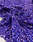 Polyester Jersey bi-stretch very soft and light, with animalier design in peach and blue shades. High-quality deadstock fabric by the meter collected in Stock from a Maison de Couture in Italy.