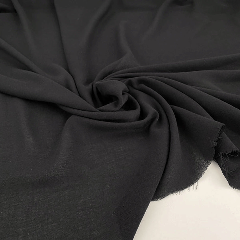 Fluid soft polyester crepe