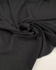 Fluid soft polyester crepe