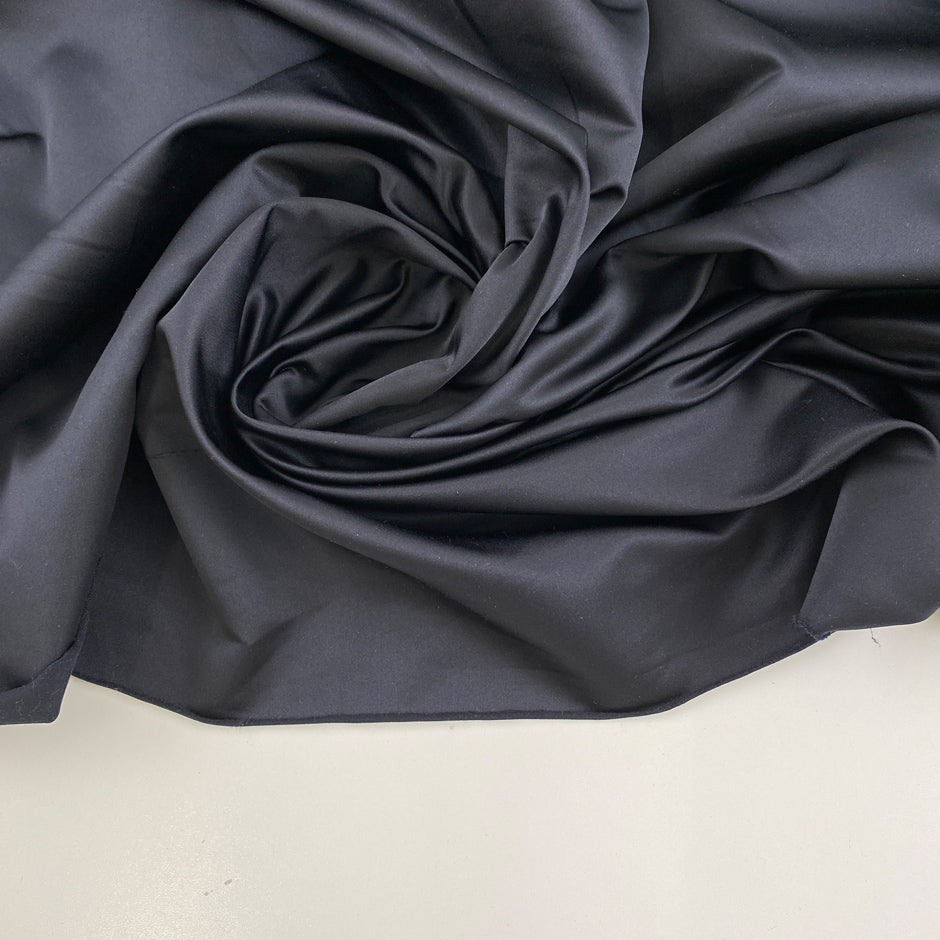Solid blue polyester satin.