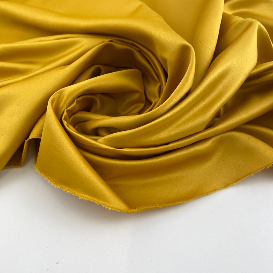Yellow polyester satin.