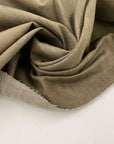 Solid beige stiff stretch yarn-dyed fabric. Deadstock fabric picked up in Stock from a Maison de Couture in Italy.