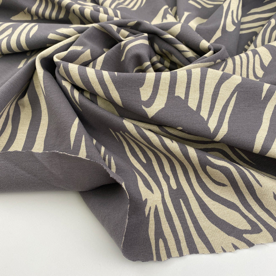 Grey stitch viscose jersey, abstract print, for modern, sustainable creations.