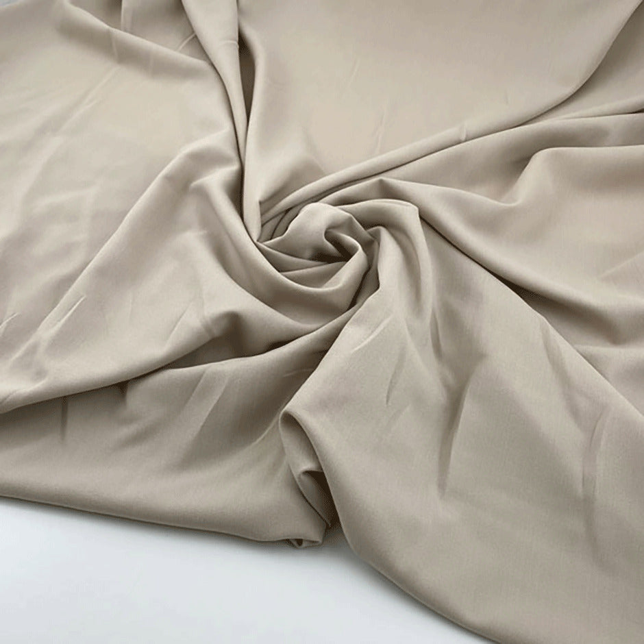 Technical fabric in soft light polyester stretch with crepe structure
