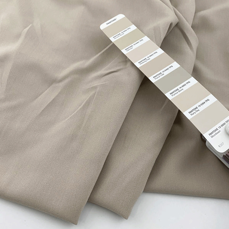 Technical fabric in soft light polyester stretch with crepe structure