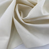 Deadstock cream wool gabardine with fliseline, ideal for eco-conscious elegant fashion.