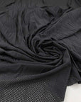 Perforated soft polyester technical stretch fabric in solid blue. High quality deadstock fabric picked up in Stock from a Maison de Couture in Italy.