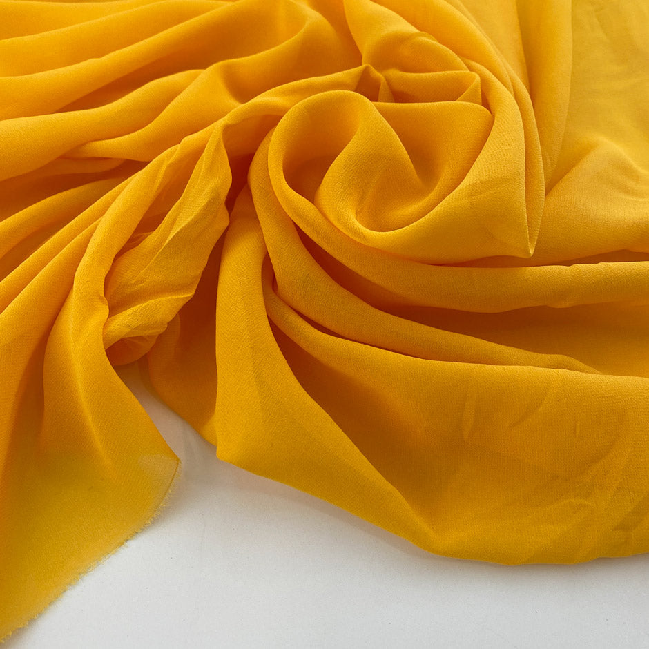 Flowing and falling transparent fabric in solid yellow silk . Picked up in Stock from a Maison de Couture in Italy. High quality deadstock fabric.