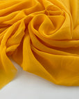 Flowing and falling transparent fabric in solid yellow silk . Picked up in Stock from a Maison de Couture in Italy. High quality deadstock fabric.
