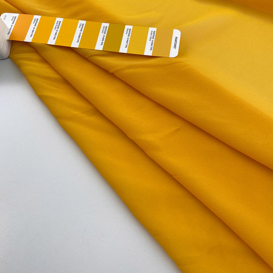 Flowing and falling transparent fabric in solid yellow silk . Picked up in Stock from a Maison de Couture in Italy. High quality deadstock fabric.