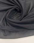 Black pure cotton mesh knit stretch and transparent. High-quality deadstock fabric collected in Stock from a Maison de Couture in Italy.