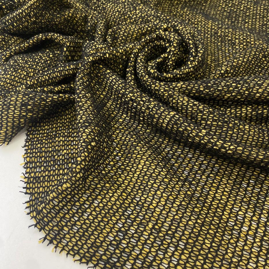 Polyester and viscose net jersey in yellow and black very soft light and transparent ideal for dresses layering and lightweight jackets. High-quality deadstock collected in Stock from a Maison de Couture in Italy.