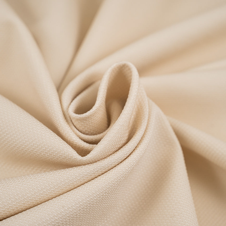 Jersey piquet viscose and poliammide punto Milano beige and heavy. High-quality deadstock fabric collected in Stock from a Maison de Couture in Italy. 