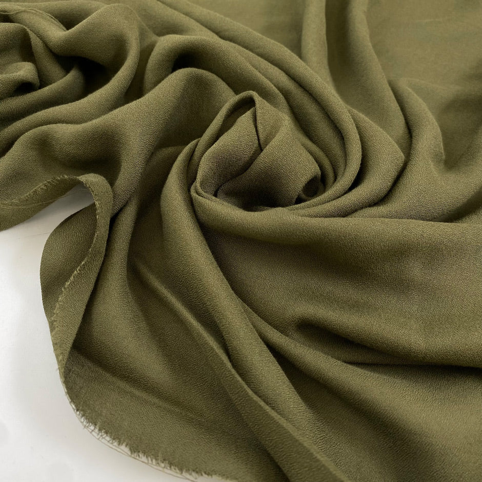 Pure viscose, very soft and light, flowy in avocado green. Ideal for shirts, skirts, dresses, and blouses. High-quality deadstock fabric by the meter collected in Stock from a Maison de Couture in Italy.