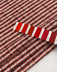 Cotton and viscose jacquard tweed fabric in white, black, red, and gold. High quality deadstock fabric collected in Stock from a Maison de Couture in Italy.