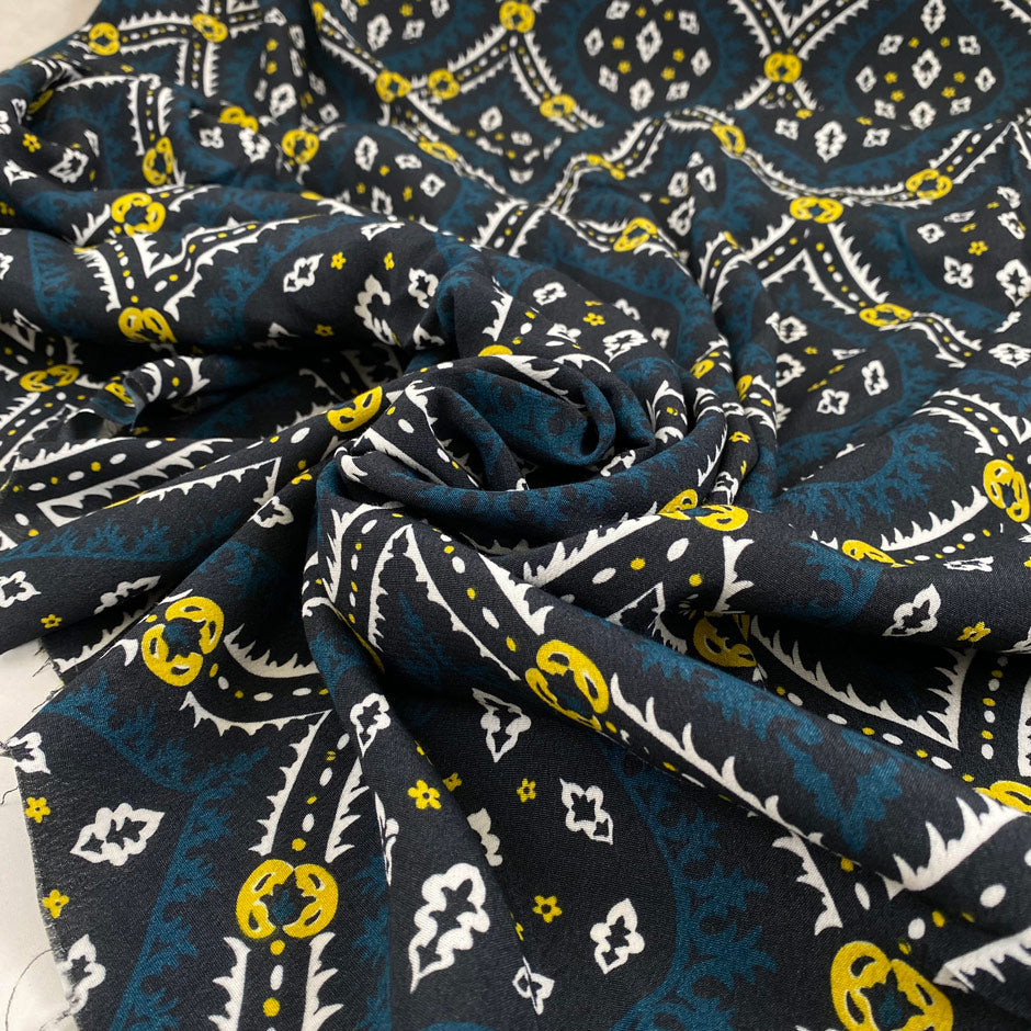 Pure viscose crepe with hypnic design in blue, dark blue, white, and yellow shades. Very soft, light with full coverage and flowy. High-quality deadstock fabric by the meter collected in Stock from a Maison de Couture in Italy.