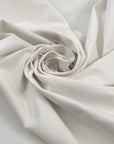 Cotton gabardine with nylon and elastane. Stretch, soft, and heavy in white. High-quality deadstock fabric collected in Stock from a Maison de Couture in Italy.