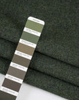 Green pure soft and spongy wool fabric. High quality deadstock fabric.