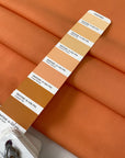 Light wool stretch in orange color reference Copper Tan. Very soft and light, flowy and not transparent. Ideal for dresses, trousers, skirts, and blouses. High-quality deadstock collected in Stock from a Maison de Couture in Italy.