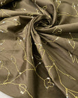Green silk with floral embroidery and delicate sequins. Slightly stiff, it adds volume and holds shape. Perfect for jackets, dresses, and skirts.High-quality deadstock collected in Stock from a Maison de Couture in Italy.