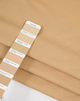 Wool and polyester elasticized camel color soft fabric. High-quality deadstock collected in Stock from a Maison de Couture in Italy.