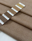 Pure wool light tweed in a tan brown melange. Very soft, medium weight, and not transparent. Ideal for jackets, skirts, or trousers. High-quality deadstock collected in Stock from a Maison de Couture in Italy.