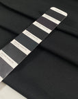 Black polyester jersey soft breathable versatile fabric ideal for everyday garments and activewear. High-quality deadstock collected in Stock from a Maison de Couture in Italy.