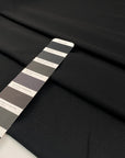 Polyester heavy twill in black, very soft with a shiny effect.