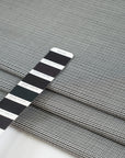 Gray checkered wool and polyester. The fabric is elastic and falling. High-quality deadstock fabric collected in Stock from a Maison de Couture in Italy.