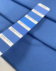 Pure cotton stretch jersey piquet in light blue color reference Cornflower Blue. Soft, textured, and comfortable. Ideal for dresses, trousers, and skirts. High-quality deadstock collected in Stock from a Maison de Couture in Italy.