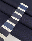 Pure virgin wool in dark blue with a tiny pied de poule pattern. Slightly stiff, perfect for structured jackets and skirts.High-quality deadstock collected in Stock from a Maison de Couture in Italy.