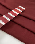 Pure cotton jersey pique, stretch in burgundy color very soft, light and flowy. High-quality deadstock fabric by the meter collected in Stock from a Maison de Couture in Italy.