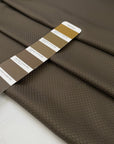 Polyester jacquard in dark brown with an ultra-small pattern, very soft, light, and slightly shiny, ideal for dresses, shirts, and fluid tailoring. High-quality deadstock collected in Stock from a Maison de Couture in Italy.