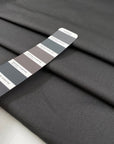 Pure cotton fabric in smoked pearl gray, with a crunchy hand and stiff structure, ideal for sculptural pieces, shirts, and outerwear. High-quality deadstock collected in Stock from a Maison de Couture in Italy.