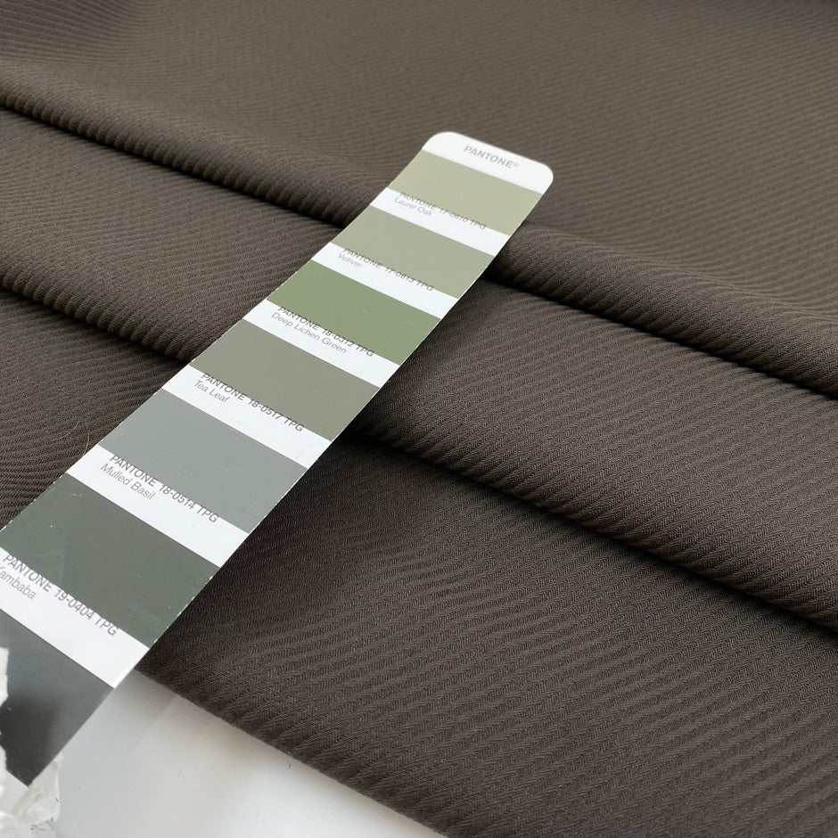Heavy cotton and viscose with a little elastane in dark gray with striped texture, very flowy, medium weight and not transparent. High-quality deadstock fabric by the meter collected in Stock from a Maison de Couture in Italy.