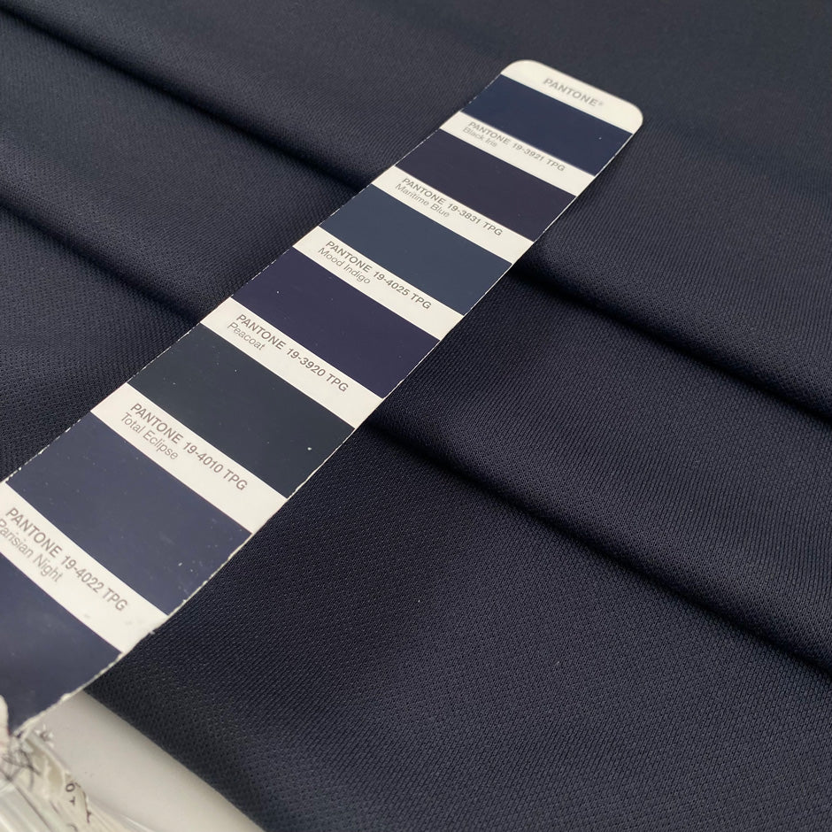 Soft knit polyester jersey piquet in anthracite piquet texture ideal for sporty garments and modern basics. High-quality deadstock collected in Stock from a Maison de Couture in Italy.