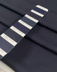 Soft knit polyester jersey piquet in anthracite piquet texture ideal for sporty garments and modern basics. High-quality deadstock collected in Stock from a Maison de Couture in Italy.