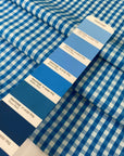 Pure cotton poplin in blue with a small check design (square size approx. half a centimeter). Very soft, light, and not transparent—ideal for shirts, dresses, and skirts. High-quality deadstock collected in Stock from a Maison de Couture in Italy.