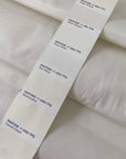 Cotton, polyester and elastane blend in white Marshmallow. Soft, not transparent, with a subtle micro texture. Ideal for trousers, dresses and skirts. High-quality deadstock collected in Stock from a Maison de Couture in Italy.